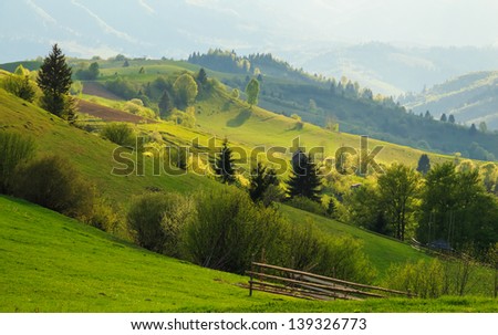 Spring gold evening rural landscape in the Mizhhiria, Carpathian mountains.