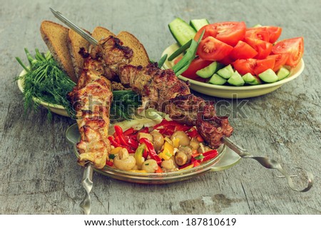 Stillife with holiday makers menu skewers with vegetables. Shallow depth of field