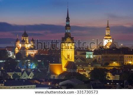 Night aerial cityscape with Medieval Old Town illuminated with Saint Nicholas Church,  Cathedral Church of Saint Mary and Alexander Nevsky Cathedral in Tallinn, Estonia