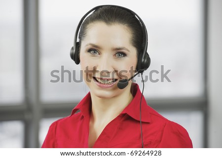 Woman telephonist in the red blouse