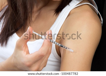Doctor make diabetes patient insulin flu shot by syringe subcutaneous arm injection vaccination isolated on a white background