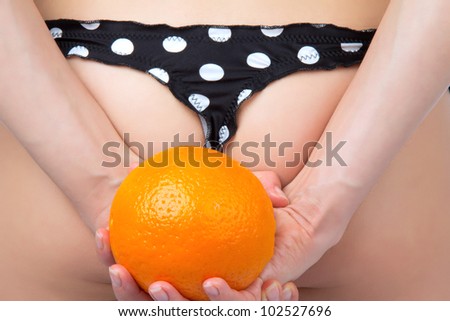 Hip, legs, buttocks and orange in hand cellulite liposuction woman weight loss control concept isolated against white background