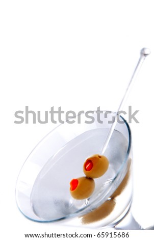 Classic Martini with olives filled by red pepper inside isolated on a white background
