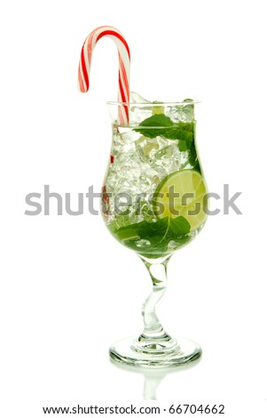 Christmas Mojito cocktail with mint leaves, lime, simple syrup, light bacardi rum, club soda and candy cane isolated on a white background