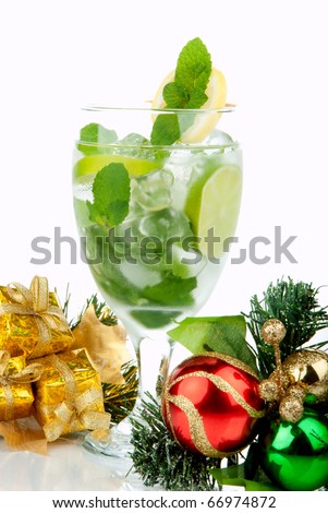 Mojito Party Club Cocktail with mint leaves, vodka, lime, simple sirup, light bacardi rum, club soda and candy cane and christmas New Year ornament decoration  isolated on a white background