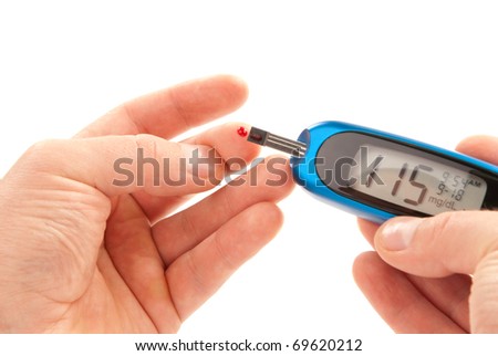 Diabetic patient doing glucose level blood test using ultra mini glucometer and small drop of blood from finger and test strips isolated on a white background Device shows 115 mg dL which is normal Diabetic patient doing glucose level blood test using ultra mini glucometer and small drop of blood from finger and test strips isolated on a white background Device shows 115 mg dL which is normal
