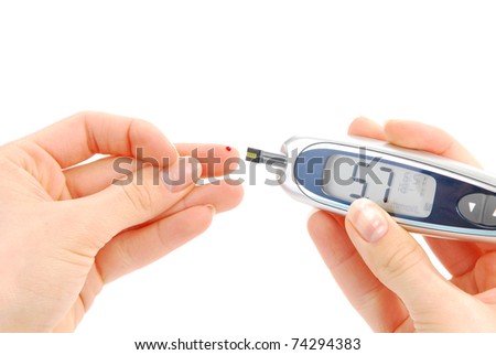 Dependent first type Diabetic patient measuring glucose level blood test using ultra mini glucometer and small drop of blood from finger and test strips isolated on a white background Dependent first type Diabetic patient measuring glucose level blood test using ultra mini glucometer and small drop of blood from finger and test strips isolated on a white background