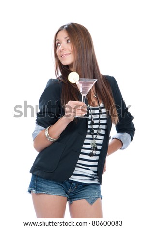 Woman drinking martini cocktail. Pretty brunette lady holding popular pink cosmopolitan cocktails drink glass with lemon in right hand isolated on a white background