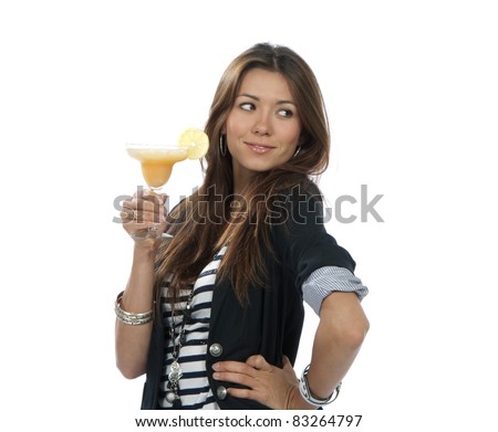 Woman drinking margarita cocktail. Pretty brunette lady holding popular orange margaritas cocktails drink glass with lemon in right hand isolated on a white background