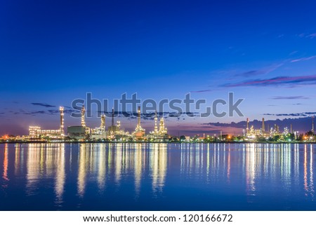 beautiful early morning twilight at petroleum refinery along the river