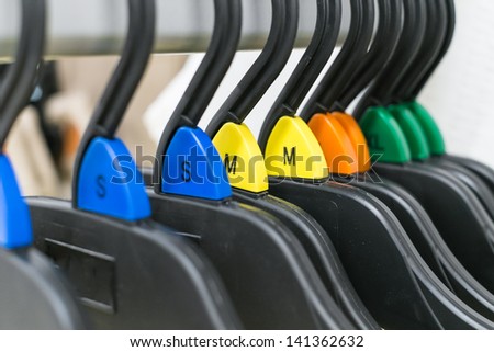 group of cloth hanger with various color sizing label in angle
