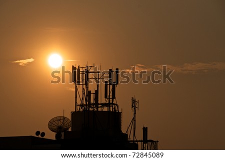 sunset at satellite dish and antenna