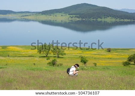 woman gathering flowers