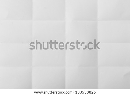 white textured sheet of paper folded in sixteen