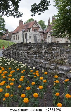 Traditional English house with a flower garden in front