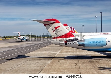 VIENNA, AUSTRIA - MAY 6: The planes of Austrian Airlines are ready for boarding on May 6, 2014 in Vienna. Austrian Airlines is the flag carrier of Austria and a subsidiary of the Lufthansa Group.