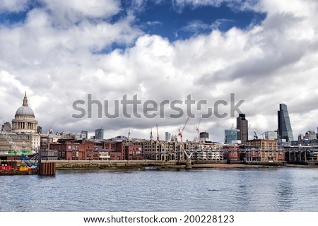 LONDON, UNITED KINGDOM - MARCH 24: St Paul\'s Cathedral and City of London on March 24, 2014 in London. St Paul\'s Cathedral sits at the top of Ludgate Hill, the highest point in the City of London.