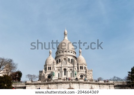 PARIS, FRANCE - MARCH 29: Basilica Sacre Coeur on March 29, 2014 in Paris. A popular landmark, the basilica is located at the summit of the butte Montmartre, the highest point in the city.