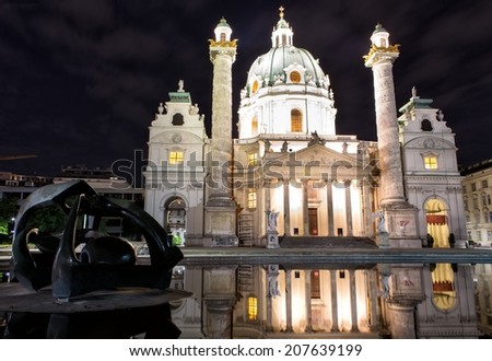 VIENNA, AUSTRIA - MAY 4: Night view from St. Charles\'s Church in Vienna on May 4, 2014. Karlskirche is a baroque church, dedicated to St. Charles Borromeo, a great reformer of the 16th century.