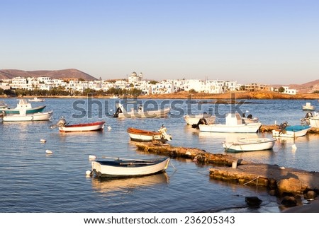 PAROS, GREECE, AUGUST 26: Fishing boats in Naussa bay, Paros on August 26, 2014. The beautiful picturesque fishing village of Naoussa is located in a huge bay in Paros island.