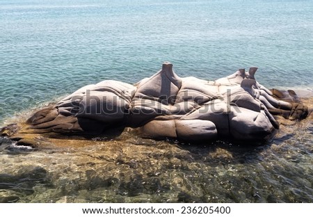 PAROS, GREECE, AUGUST 26: Sculptured granite blocks Kolimbithres beach on August 26, 2014. Kolimbithres is one of the most famous beaches of Paros and is located in the huge bay of Naoussa.
