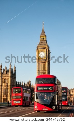 LONDON, UNITED KINGDOM - JANUARY 2: The Elizabeth Tower on January 2, 2015 in London. The Clock Tower, named in tribute to Queen Elizabeth II, more popularly known as Big Ben and iconic red buses.