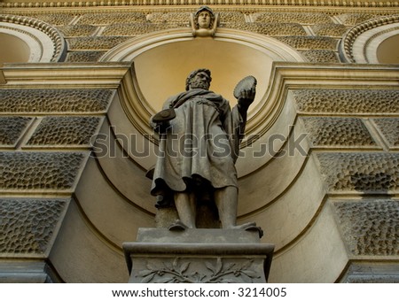 Ancient sculpture of a man holding a hammer