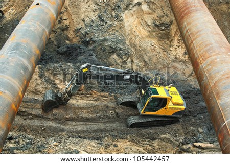 Excavator in open pit