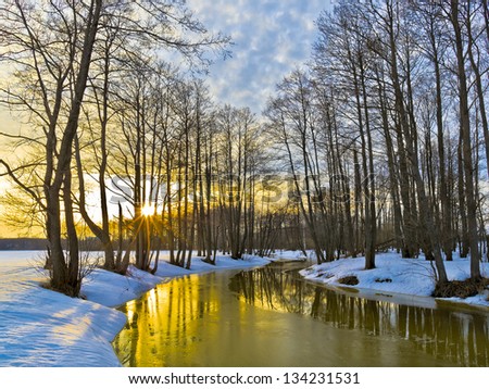 Yellow sunset in early spring. River Sukhodrev. Kaluga region. Russia