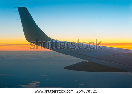 View of sunset from airplane window