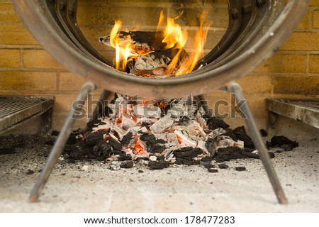 light a fire to cook