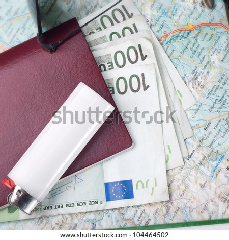 Getting ready for a trip - European passport, sunglasses road map and euros.