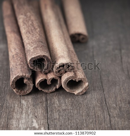 Close up of Cinnamon Sticks on Wooden Table