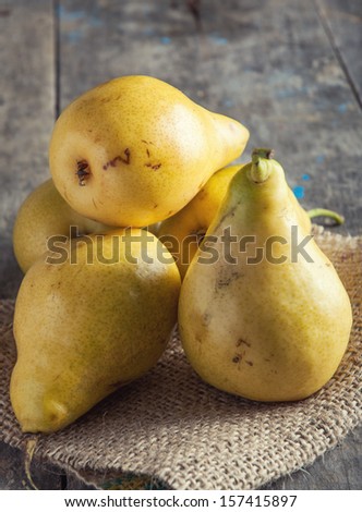 Tasty yellow pears on table; agriculture background image
