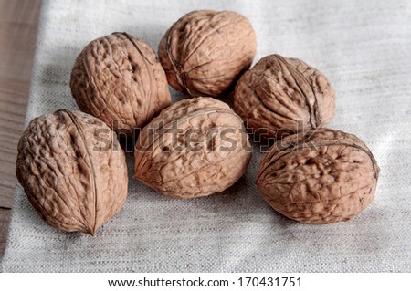 Close-up of a pile of nuts  on wooden background