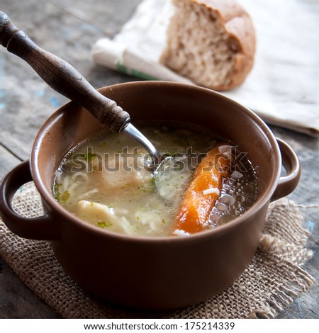 homemade chicken soup on table, natural light