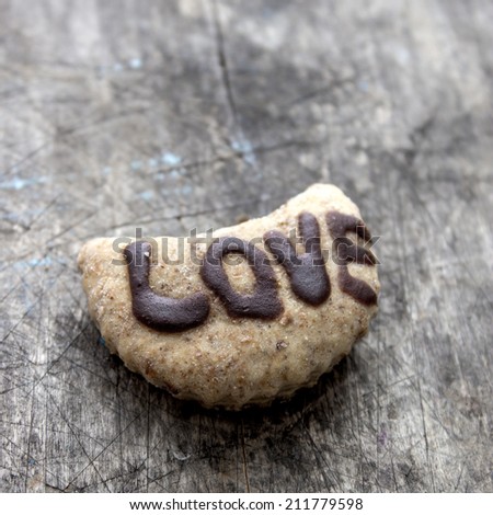 Close up of homemade love cookies on wooden background