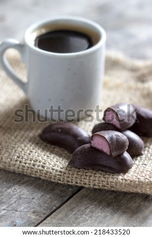 chocolate candies and cup of coffee, natural light