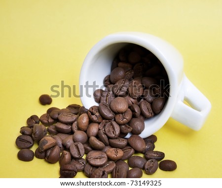 coffee beans over yellow background