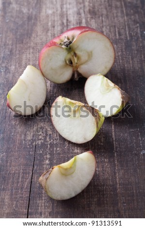 sliced apples on old wooden table