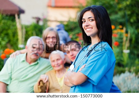 Confident doctor welcoming the family in residential care home.