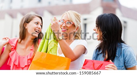 Girlfriends enjoying their time together shopping in town.