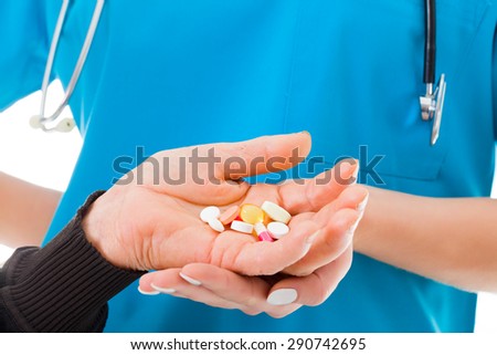 Elderly hands holding medications given by the doctor who prescribed it.