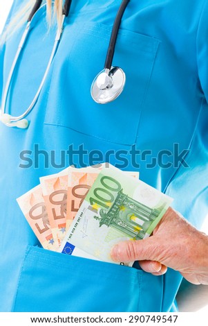 Senior woman giving soap money to doctor - healthcare costs concept.