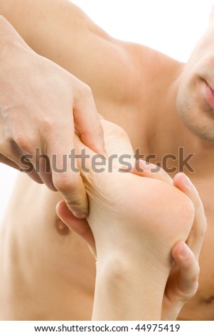 stock photo A mature man massaging his girlfriend's wife's feet