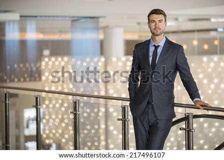 Portrait of a handsome young businessman in a shopping center