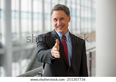 Portrait of a CEO giving a handshake