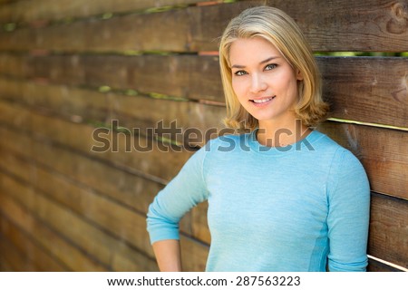 beautiful blonde single woman head shot outdoors perfect smile