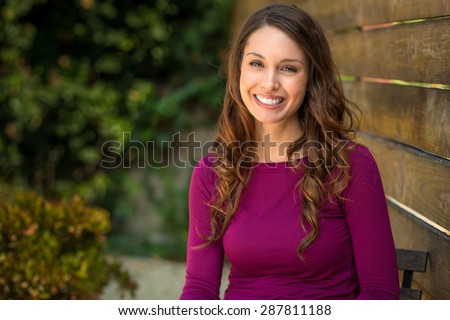 Happy brunette feminist millennial young adult smile