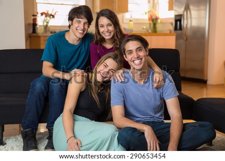 Family siblings at home smiling for a portrait love each other gathering reunion